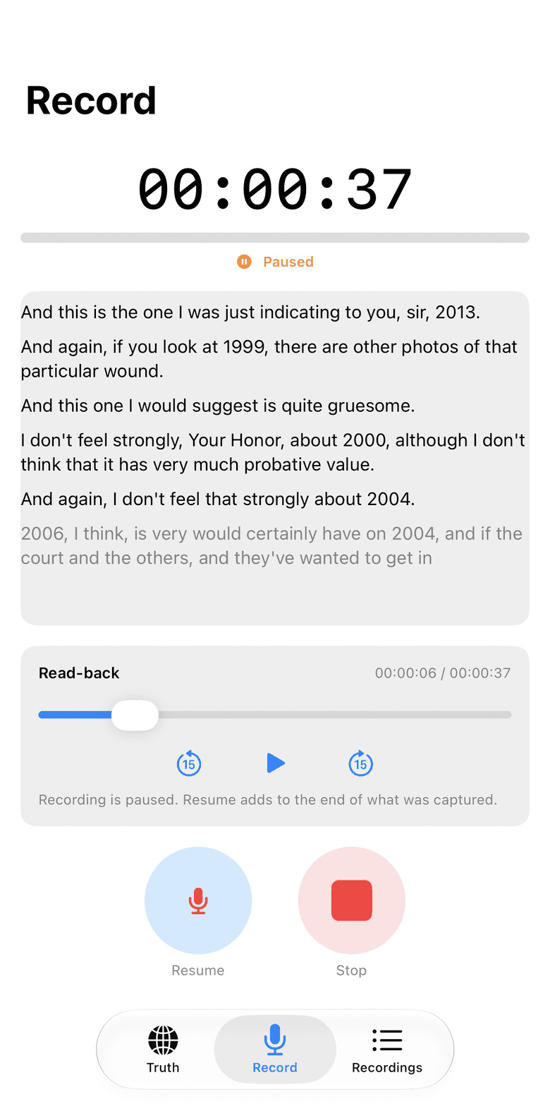 The iPhone app paused mid-recording, showing the read-back player with a scrubber and skip controls under the transcript so far.